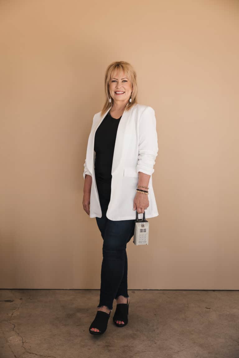 Wina Gill, San Luis Obispo County Realtor, standing welcoming home sellers